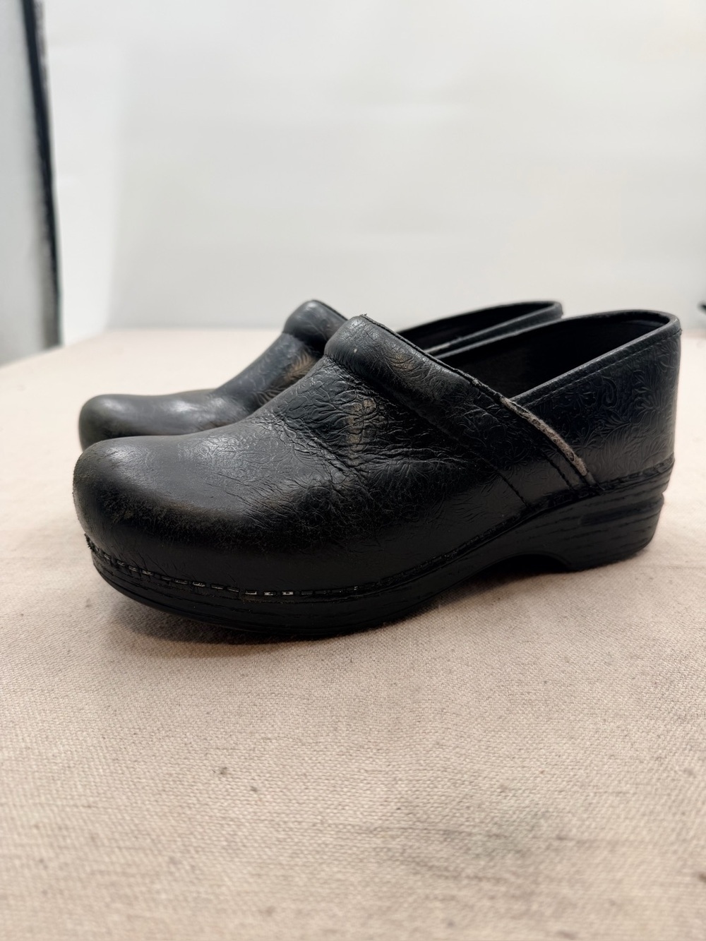 Dansko XP Women's Black Leather-Textured Slip-On Clogs